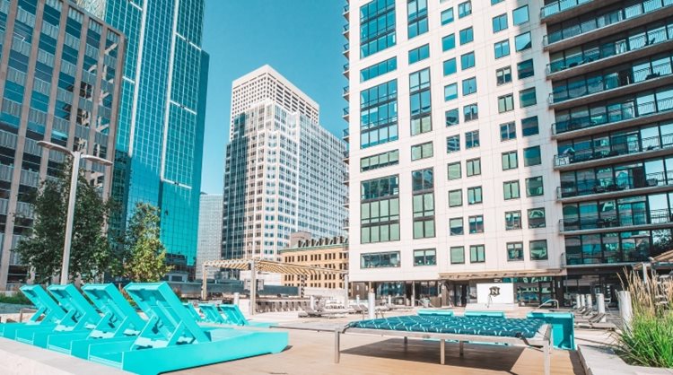 A poolside view of several large apartment buildings in Minneapolis, Minnesota. 