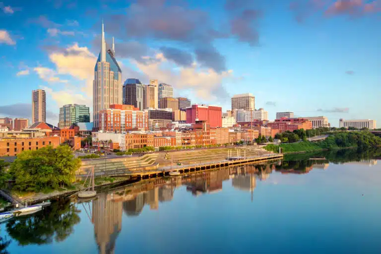 The downtown Nashville skyline seen from across the Cumberland River just after sunrise.