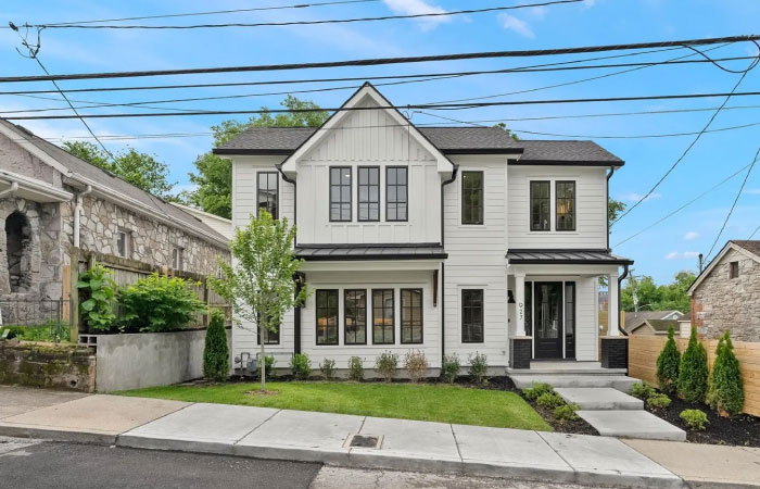 A newly constructed two-story home on an incline residential street in Nashville’s Hope Gardens neighborhood.