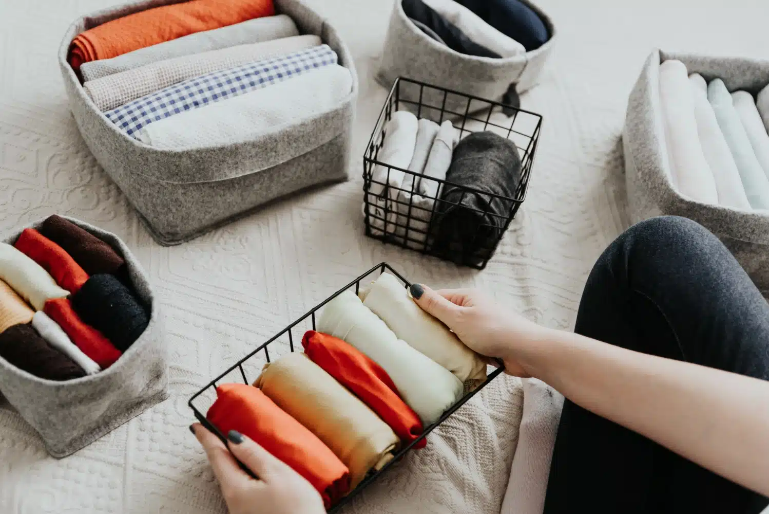 organized clothes baskets with folded clothes