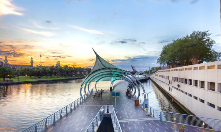 The Tampa Riverwalk at dusk with the unique University of Tampa in the background. 