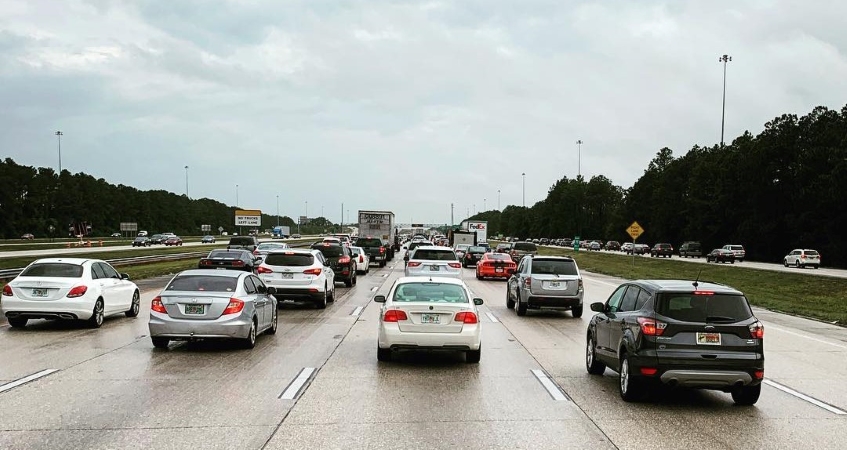 A view from behind of traffic in Tampa, FL, on an overcast day.