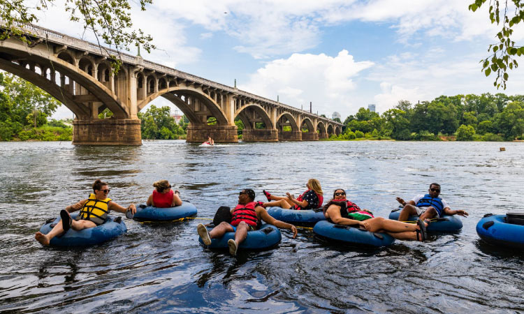 Six friends enjoying an afternoon tubing on the river near Columbia, South Carolina.