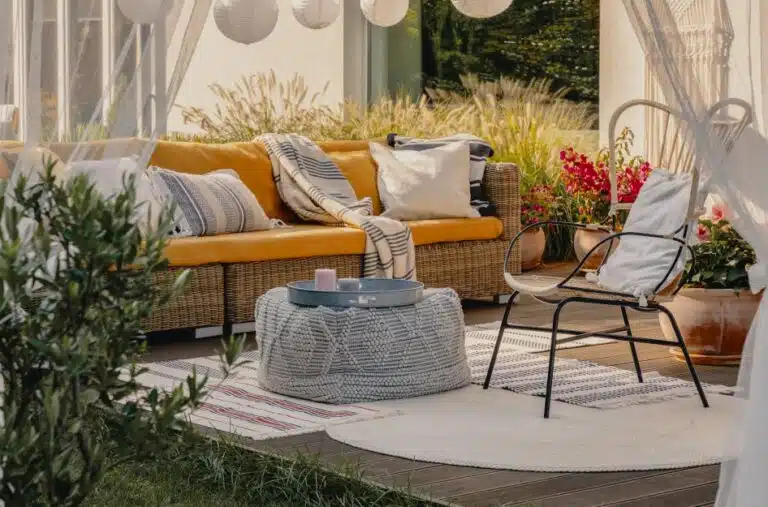 A remodeled patio with wicker furniture
