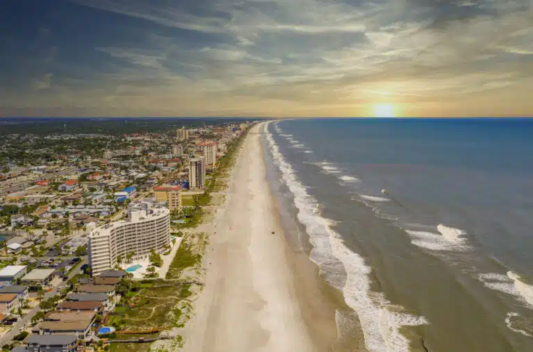 Jacksonville Beach with the sun cresting over the water
