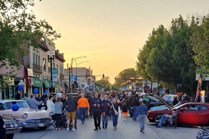  Dozens of locals take to the streets to enjoy a community event in Chicago’s Edison Park neighborhood — one of the safest Chicago neighborhoods. 