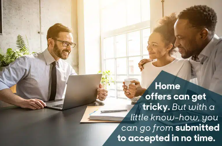 A real estate agent helps a couple make an offer