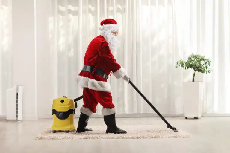 santa claus vacuuming floor