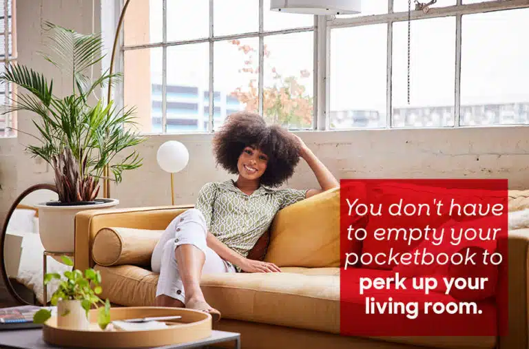 smiling woman on couch in living room