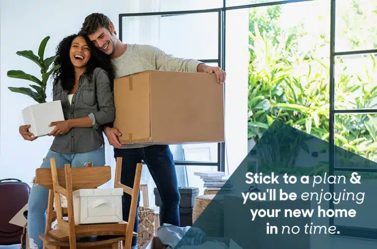 couple moving in together with moving boxes