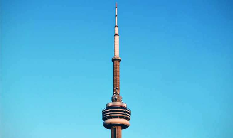 A view of Toronto’s 360 Restaurant at the top of the CN Tower on a clear, sunny day.