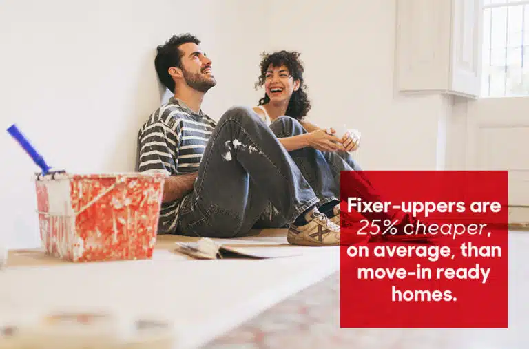 couple laughing as they renovate a fixer upper