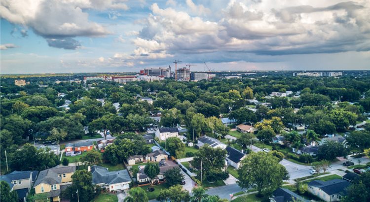 Aerial view of College Park, one of the best neighborhoods in Orlando, as fluffy clouds start rolling in overhead