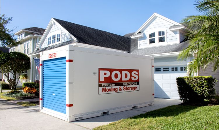 A PODS portable moving and storage container is conveniently positioned in a residential driveway in Orlando, Florida