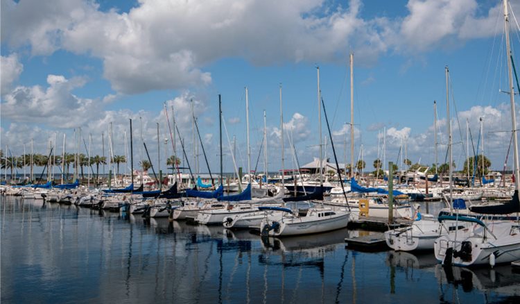 Dozens of sailboats are docked in a sunny marina in Sanford, one of the best neighborhoods in Orlando, Florida