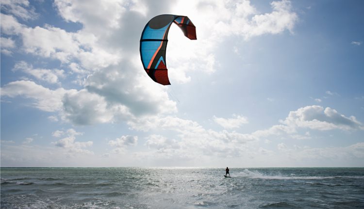  A man parasailing on the Atlantic Ocean, off the coast of Miami