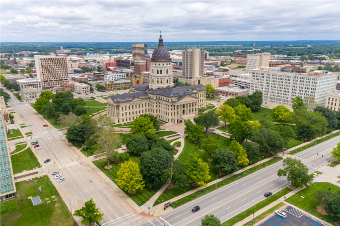 Aerial view of the state capitol building in Topeka, Kansas, on an overcast summer day