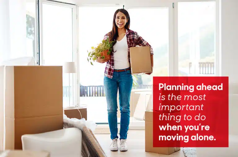 woman holding a moving box