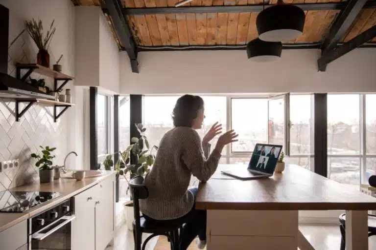 woman having a video call in her kitchen