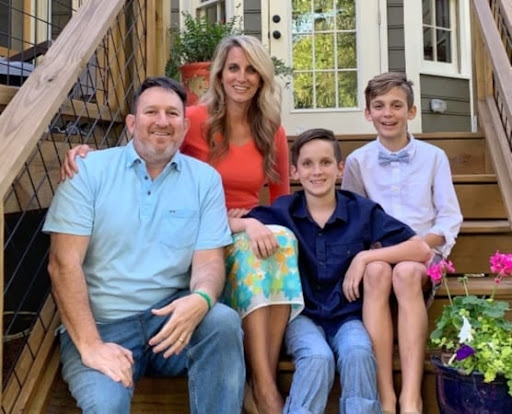 Marietta, Georgia, real estate agent Lindsey Ramsey and her family are posing for a photo on the steps of their porch. 