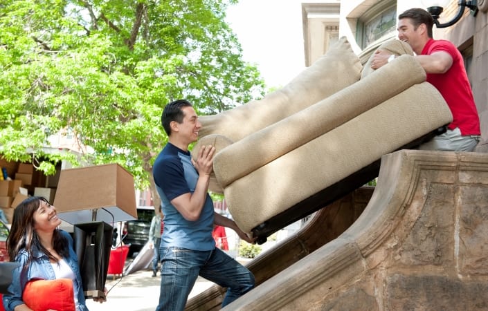 men moving a couch 