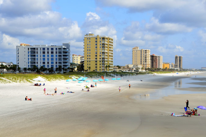 Locals are enjoying a sunny day on a beach in Jacksonville, Florida