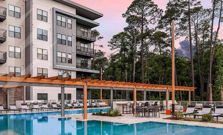 A poolside view of the JTB Apartments in Jacksonville, Florida