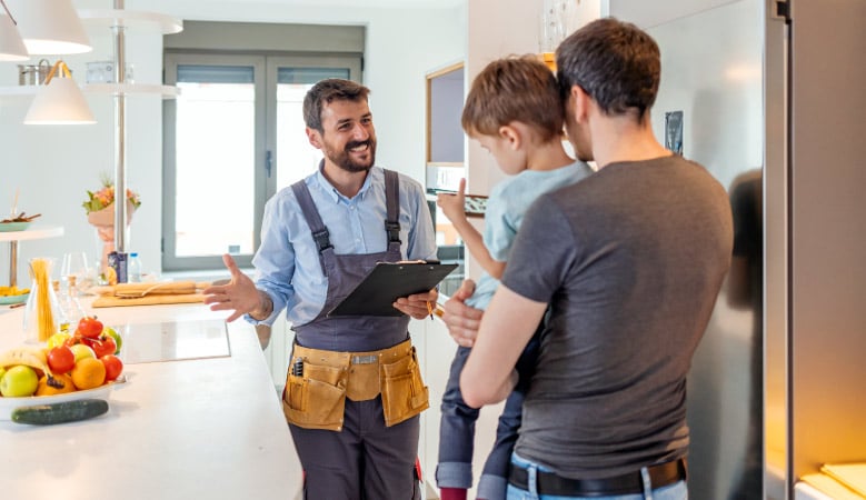 A man and his child talking to their new contractor