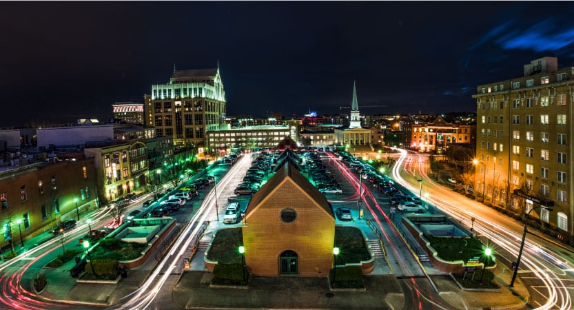 A time lapse of traffic gives a dazzling display of light on the streets of Downtown Greenville, SC, at night.