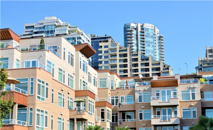 A shot looking upwards at various apartments in downtown Seattle.