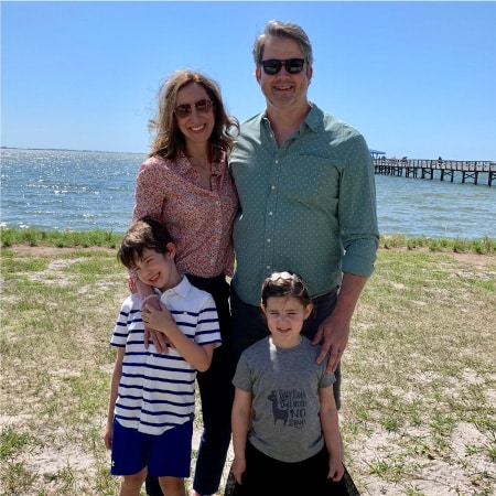 A family standing on the beach