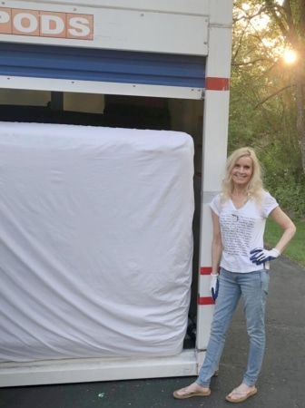 Michelle from Hello Lovely stands beside a fully loaded PODS portable container.