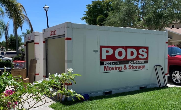 PODS moving containers being loaded in a driveway