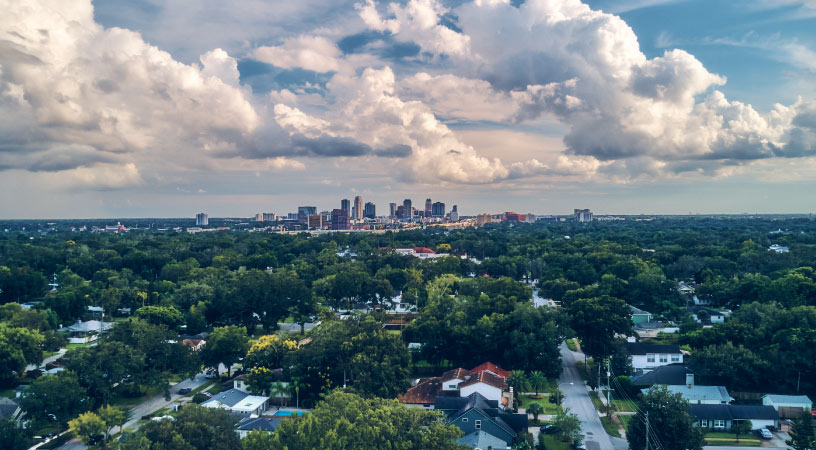 The skyline of Orlando seen from College Park on a cloudy day.
