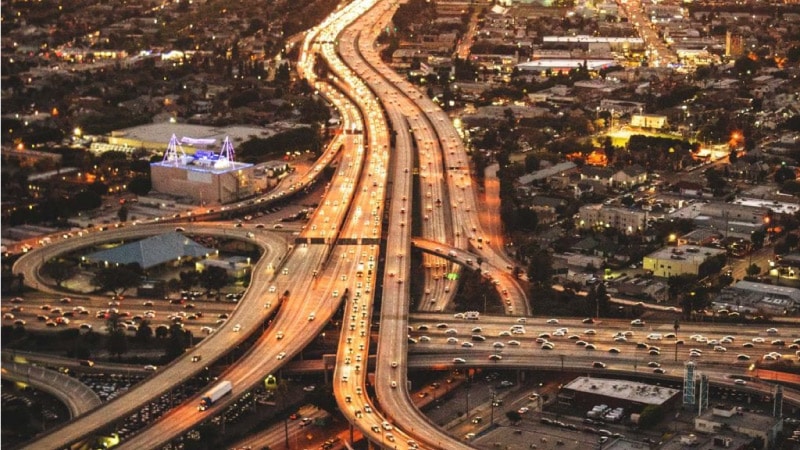 An aerial view of some of the massive freeways in the Los Angeles area, including a few curved exit roads. 