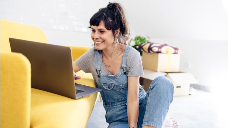 a woman posting an ad online for her garage sale
