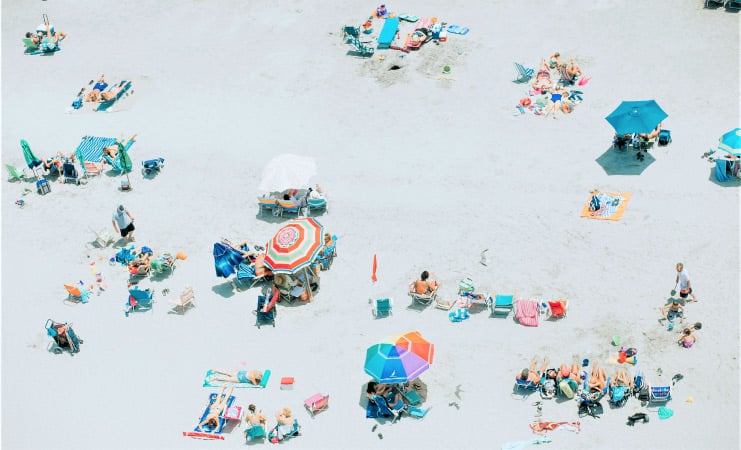An overhead shot of sunbathers, snorklers, and beach bums on Myrtle Beach