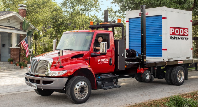 A PODS truck carrying a PODS container