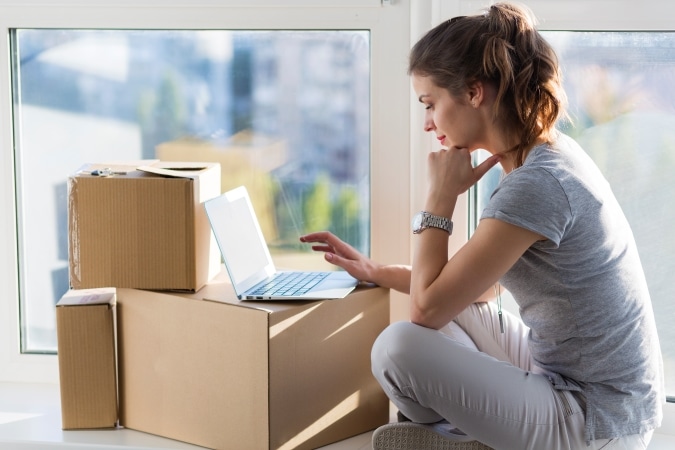 Woman researching relocation services online