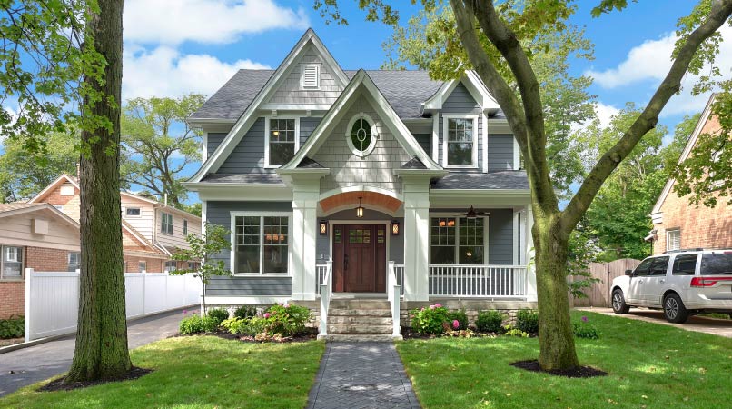 small gray house with shady front yard