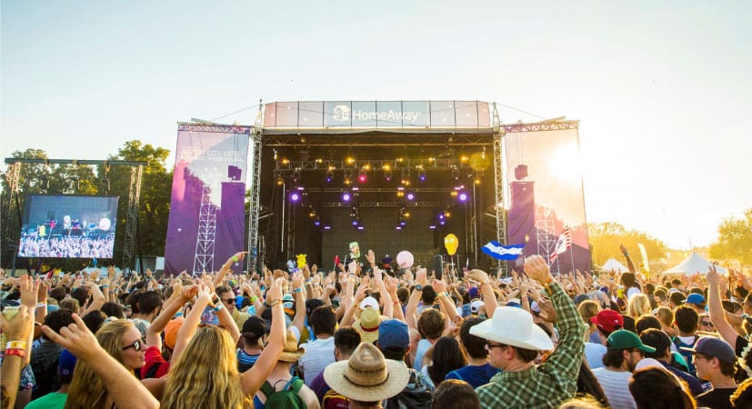 An excited crowd watches a live performance at the Austin City Limits Music Festival.