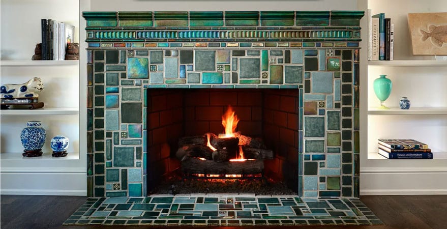 A custom fireplace surround and hearth made from colorful tiles from Pewabic Pottery in Detroit.