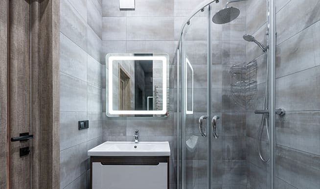 A simple, compact walk-in shower. The shower door is rounded,making a small space feel bigger. 