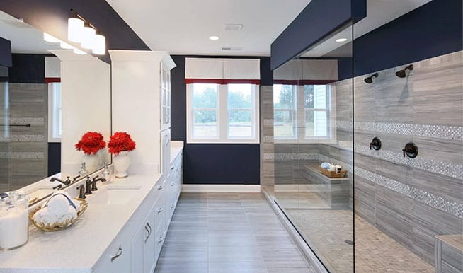 A sober, clean bathroom that uses minimal elements to create a striking space. 
