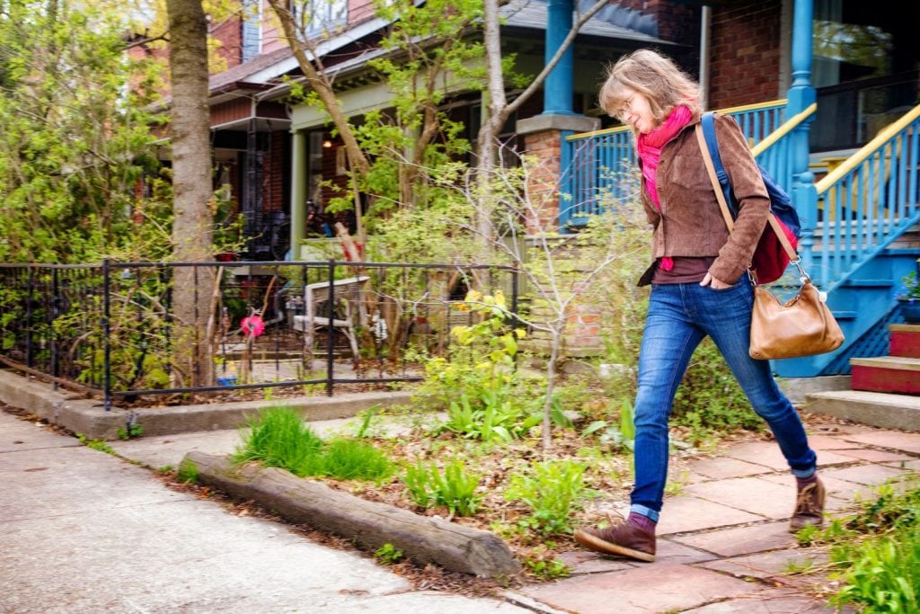 woman walking outside home