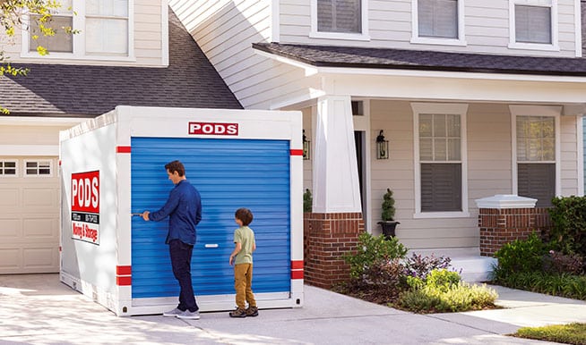 A PODS container placed outside a home, storing extra pieces while the family renovates