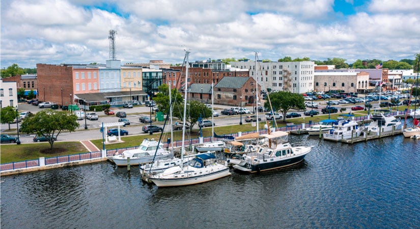 Aerial view of boats docked in the Pamlico river near downtown Washington, North Carolina, on a lovely summer day.