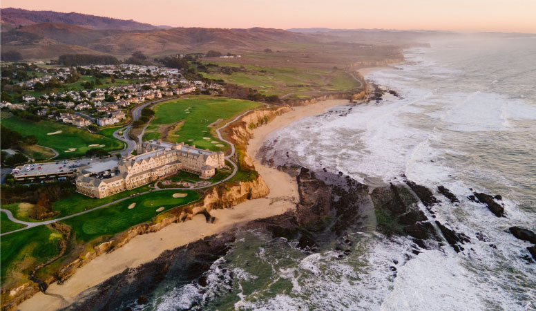 The Ritz-Carlton and Half Moon Bay Golf Links at sunset overlooking the Pacific Ocean in Half Moon Bay, California.