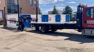 PODS container being loaded onto a truck