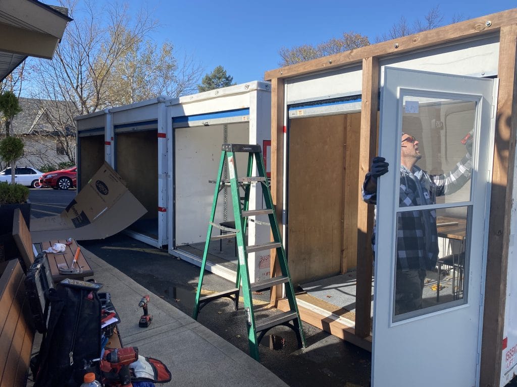 PODS containers being modified into dining rooms for COVID friendly restaurant designs